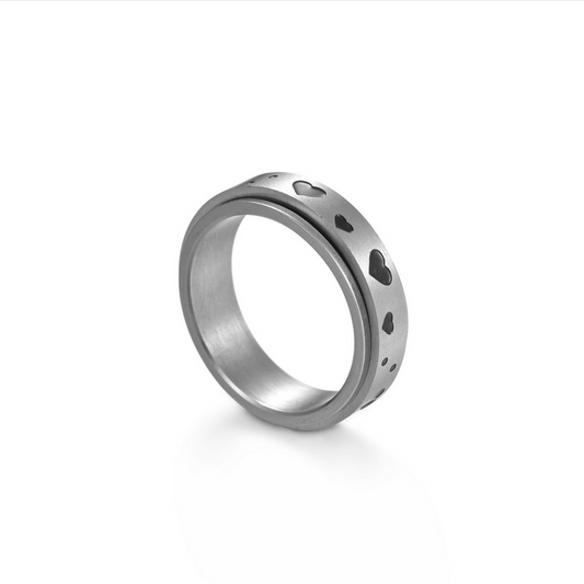 Thin silver fidget ring with black hearts along the whole band.